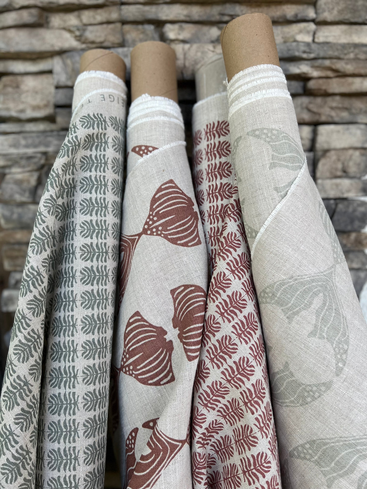 Daphne stripe fabric by Greige Textiles — a modern, organic pattern featuring abstract fishlike forms, hand-printed on Belgian linen for drapery, cushions, or upholstery.