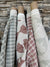 Daphne stripe fabric by Greige Textiles — a modern, organic pattern featuring abstract fishlike forms, hand-printed on Belgian linen for drapery, cushions, or upholstery.