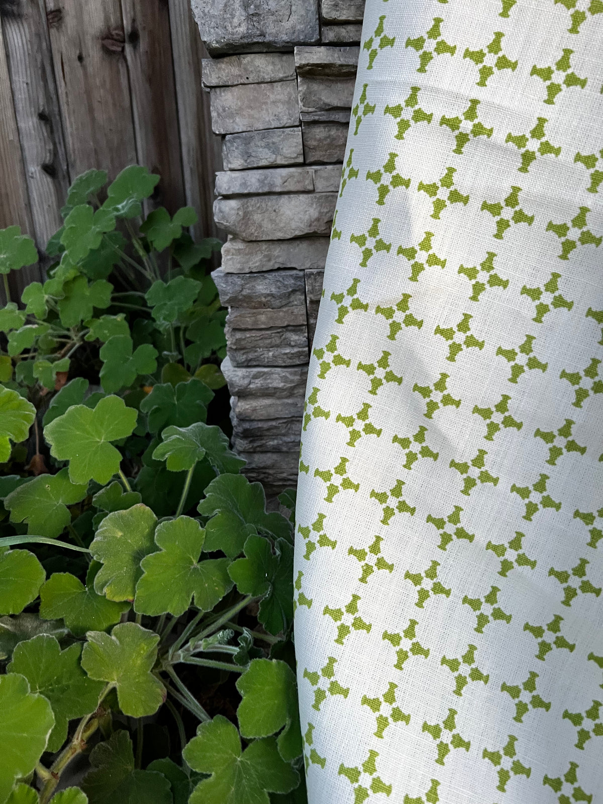 Greige Textiles’ CanCan — an airy, geometric linen fabric with a plaid-influenced cross motif, designed for timeless applications in residential and boutique commercial interiors