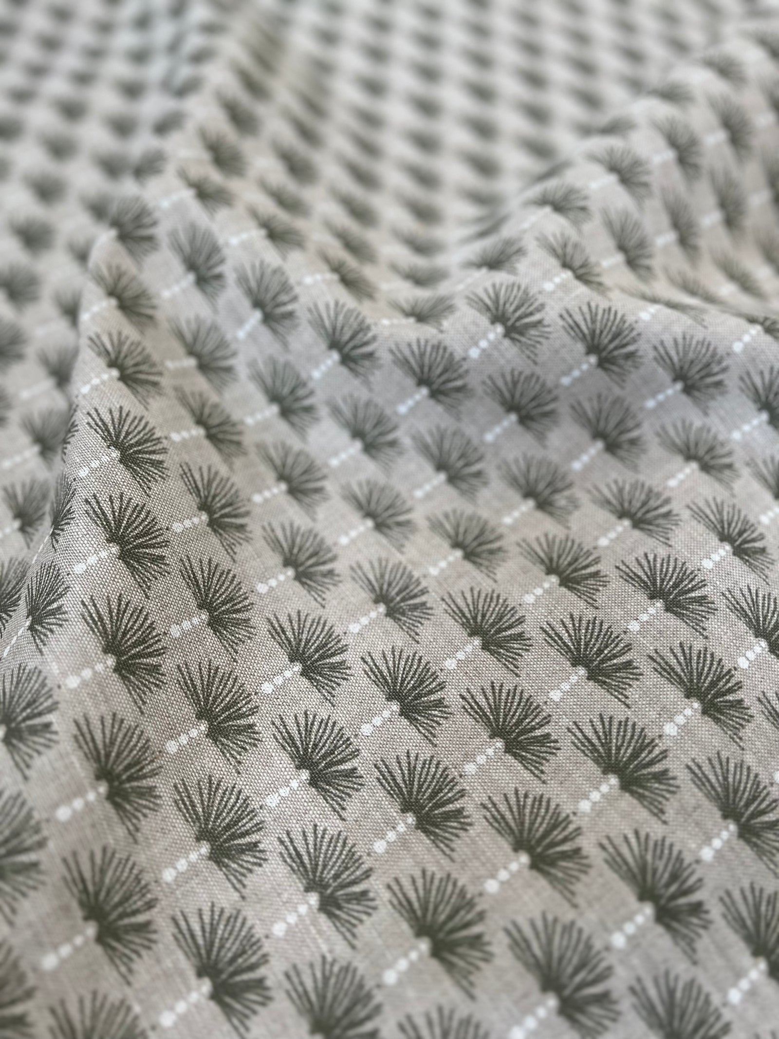 Nathalie is a soft, architectural motif inspired by the quiet elegance of Parisian doorways and arches. Like the worn embossments that grace the city’s façades, this pattern carries a sense of history—refined, welcoming, and quietly storied.