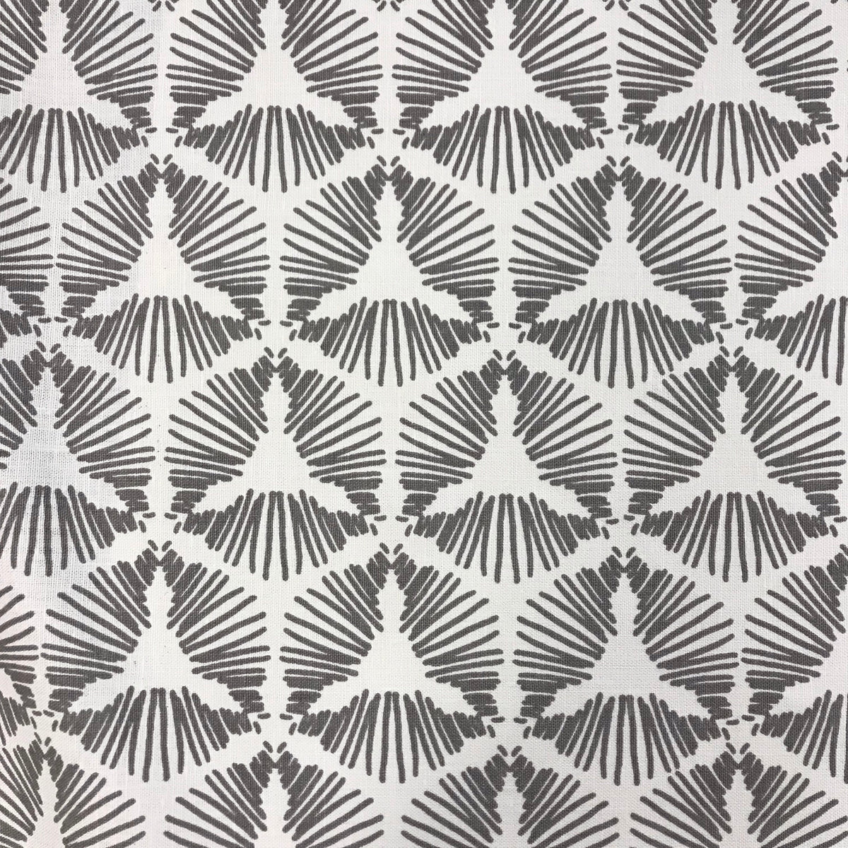 greige textiles Cie – where geometry meets excitement. A bold starburst shield pattern printed on luxurious Belgian linen, designed to bring theatrical flair and flow to interior spaces.