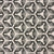 Cie by Greige Textiles — a dramatic starburst shield motif that brings graphic energy and sculptural movement to interiors. Hand printed on Belgian linen, it's a bold choice for drapery, statement cushions, or tailored upholstery.