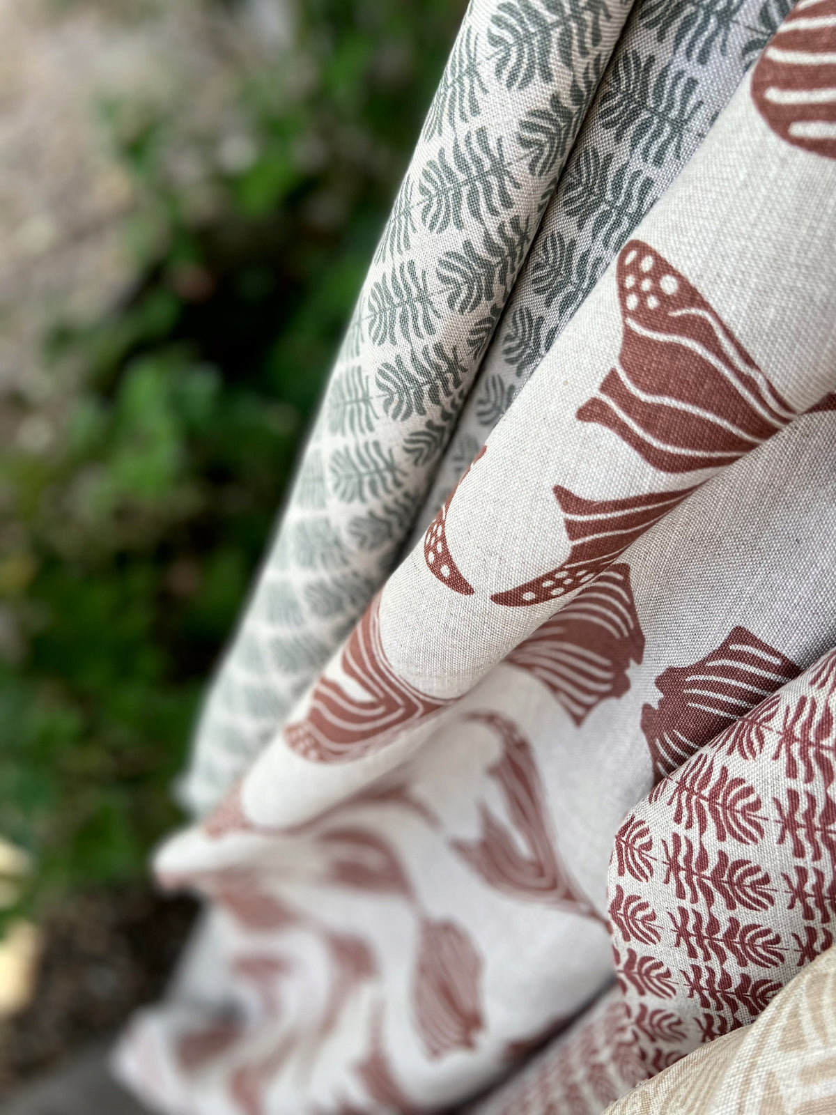 Daphne stripe fabric by Greige Textiles — a modern, organic pattern featuring abstract fishlike forms, hand-printed on Belgian linen for drapery, cushions, or upholstery.