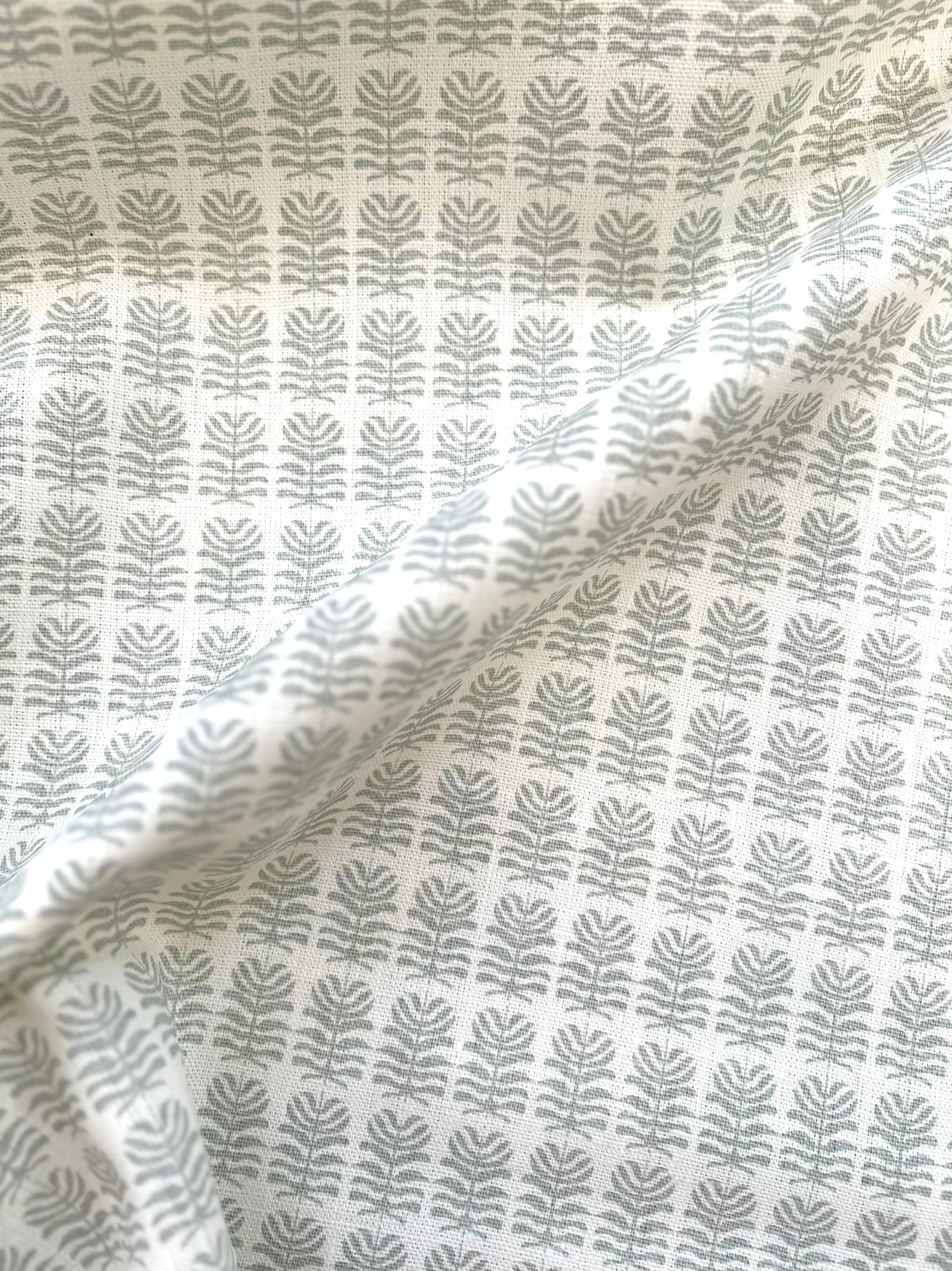 Hand-printed Clara design – Small botanical motif on Belgian linen, suited for interior uses such as drapery, accent pillows, and upholstered pieces.