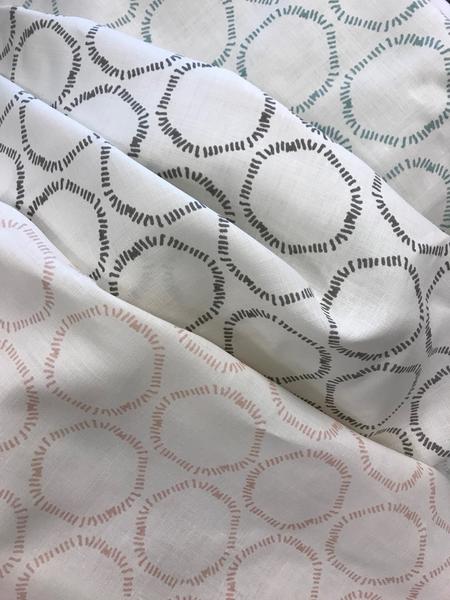 Cape by Greige Textiles — an organic open circular pattern hand-printed on Belgian linen, ideal for drapery, upholstery, and decorative accents in refined interiors.