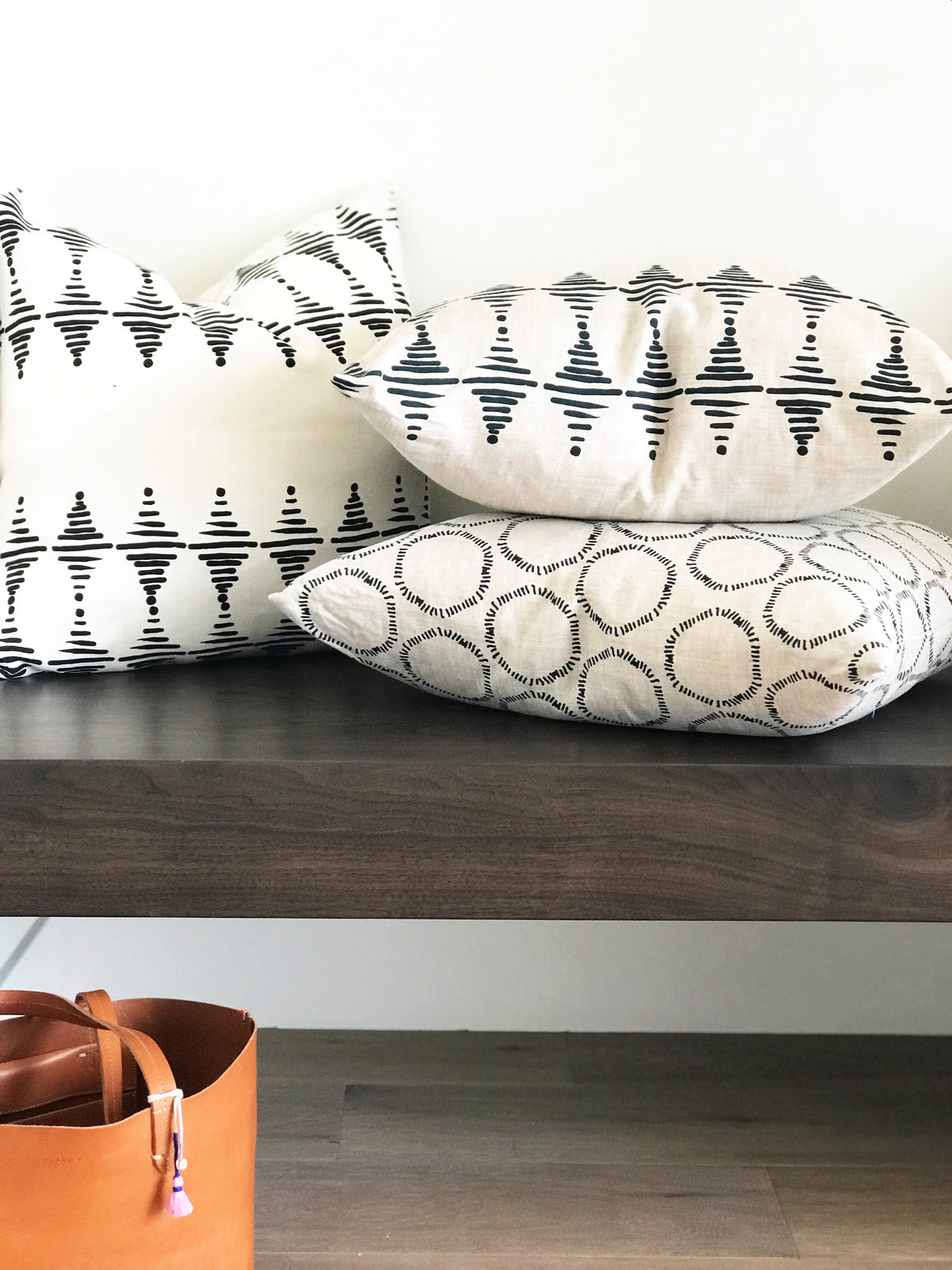 Stacked fabric Black on Oyster black and white fabric belgian linen from california. Artisan fabrics and wallpapers from Greige Textiles—created for interiors with intention and style.