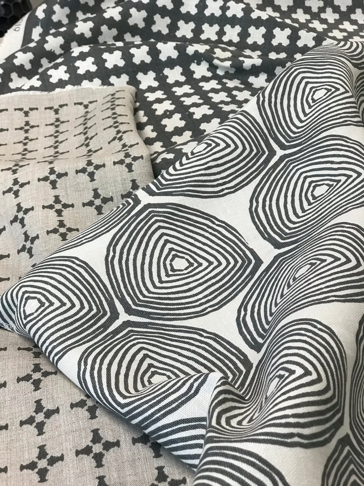 CanCan fabric — inspired by the geometry of brick edging, this open plaid pattern is hand-printed and ideal for bringing structure and subtle pattern to interior design schemes.