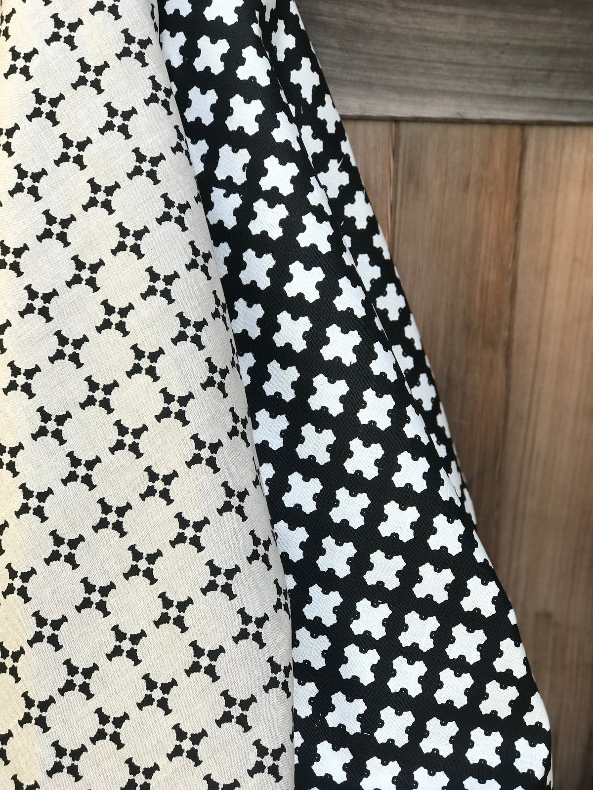 greige textiles cancan black on oatmeal hand made in california Greige Textiles’ CanCan — an airy, geometric linen fabric with a plaid-influenced cross motif, designed for timeless applications in residential and boutique commercial interiors.