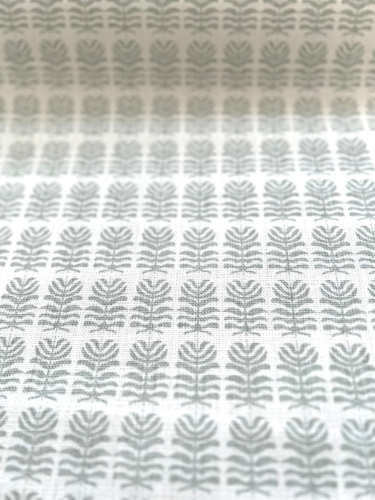 Hand-printed Clara design – Small botanical motif on Belgian linen, suited for interior uses such as drapery, accent pillows, and upholstered pieces.