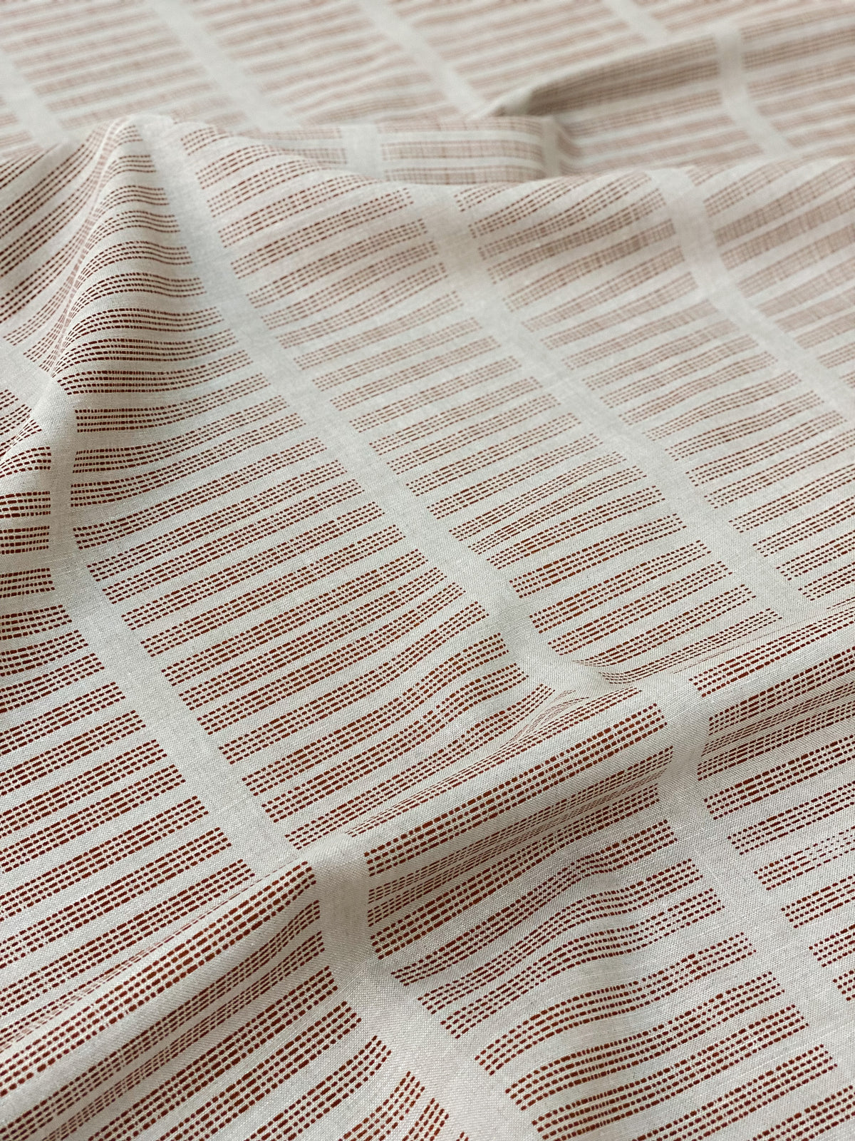 Hand-printed linen textiles from Greige—bold, heritage-inspired designs for interiors. Explore our full collection.