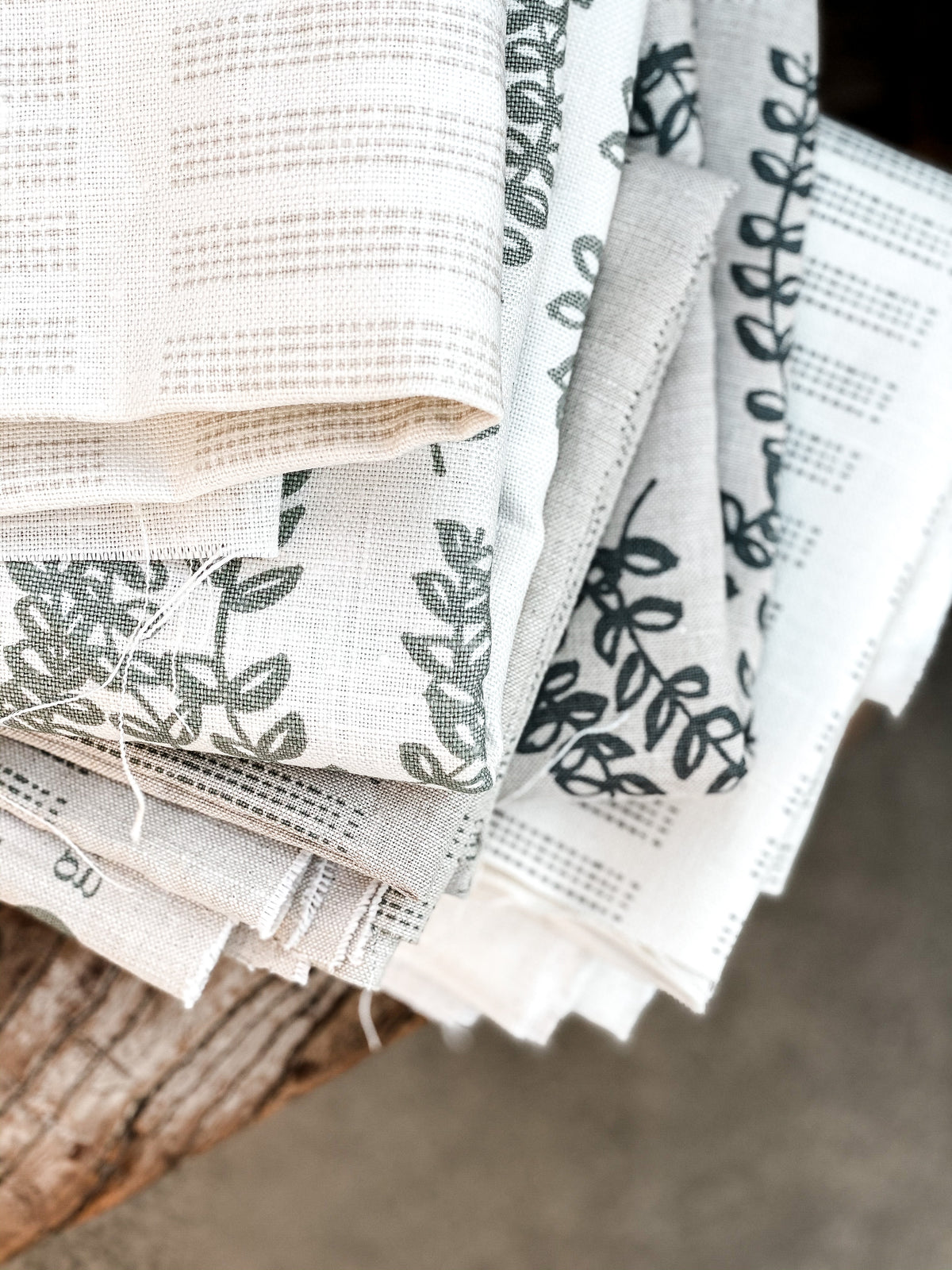 Antoinette pattern — a handmade linen fabric with a graceful trailing floral motif, crafted for pillows, drapery, and upholstery.