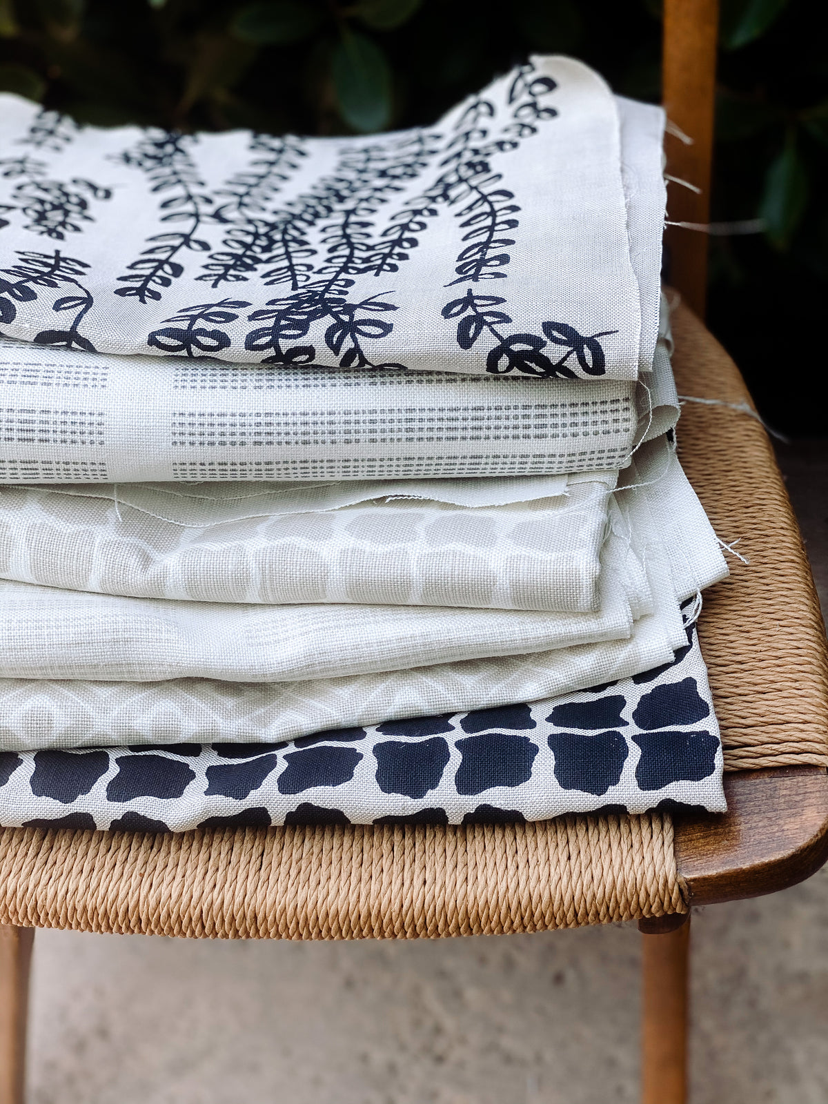 Antoinette pattern — a handmade linen fabric with a graceful trailing floral motif, crafted for pillows, drapery, and upholstery.