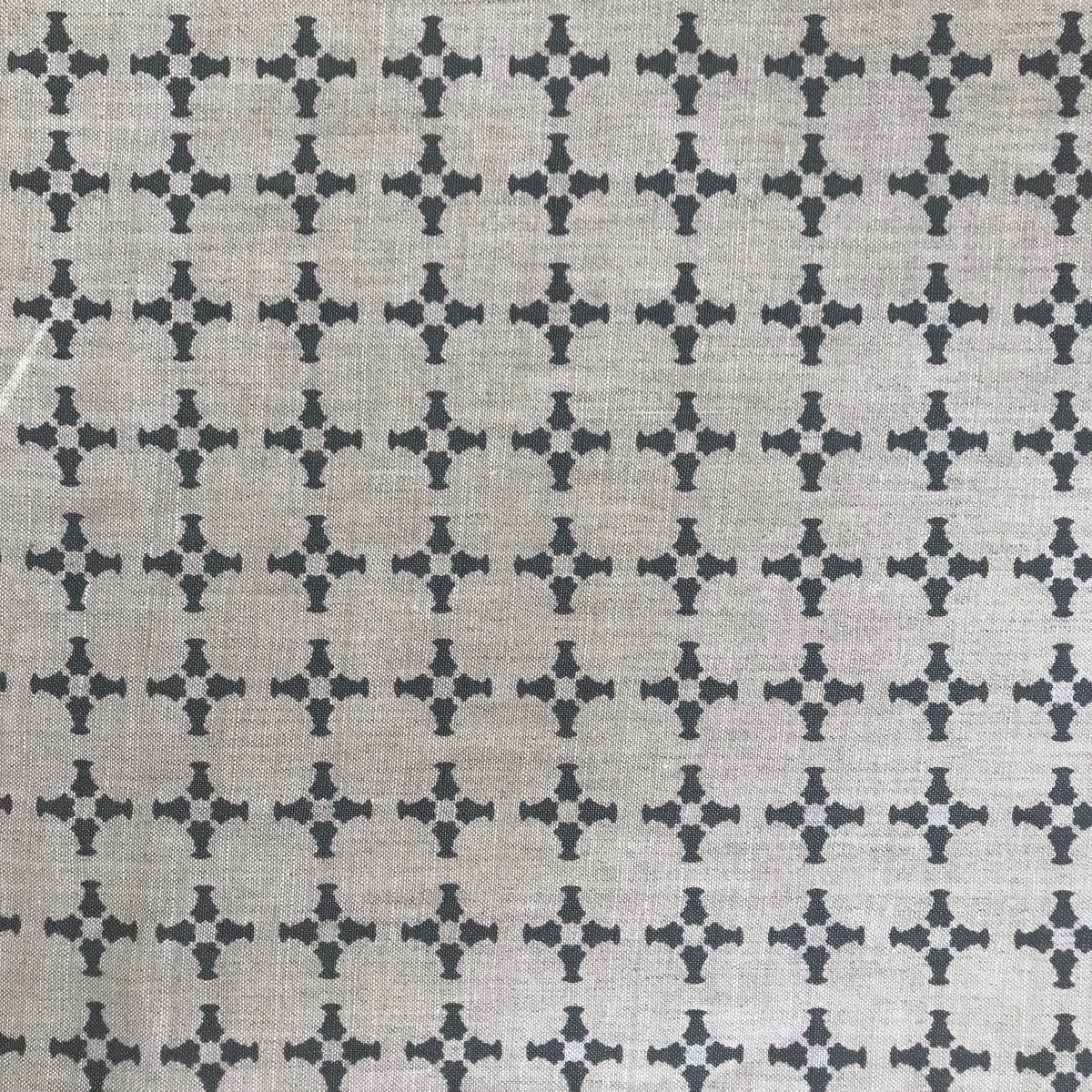 CanCan fabric — inspired by the geometry of brick edging, this open plaid pattern is hand-printed and ideal for bringing structure and subtle pattern to interior design schemes.