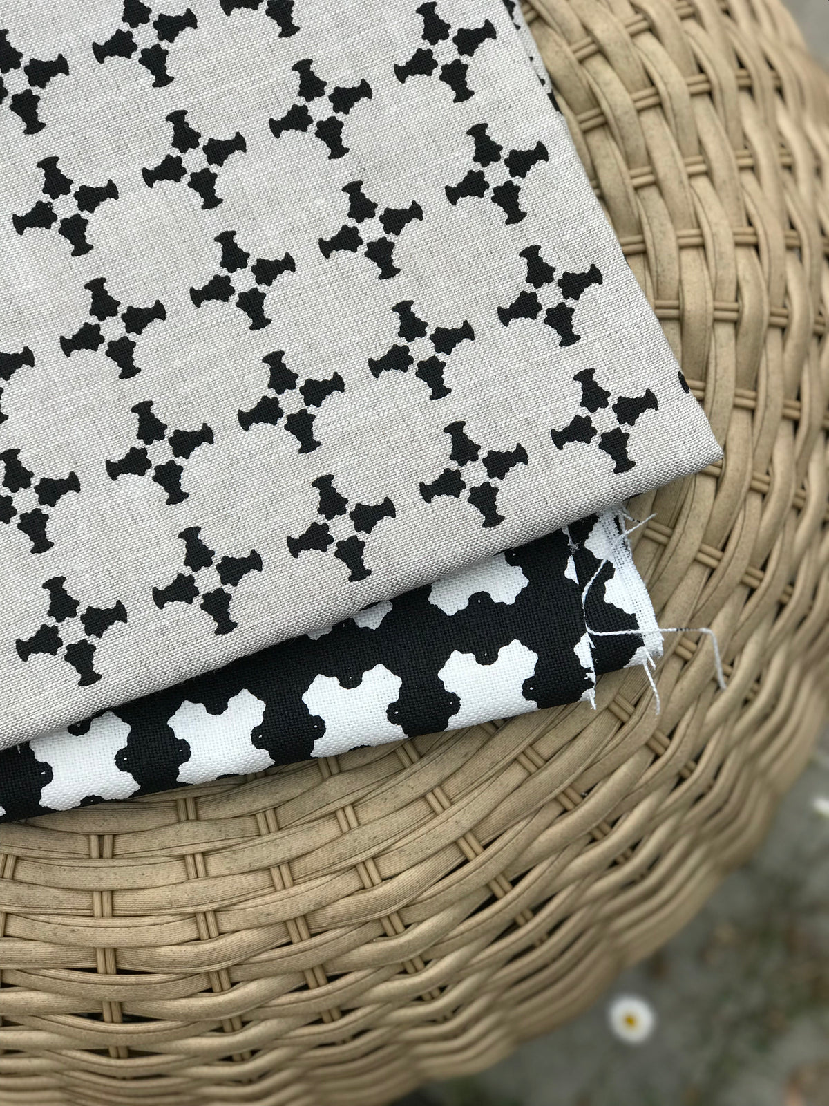 Greige Textiles’ CanCan — an airy, geometric linen fabric with a plaid-influenced cross motif, designed for timeless applications in residential and boutique commercial interiors.